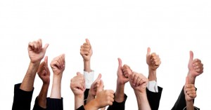 Business People with Thumbs Up on White Background